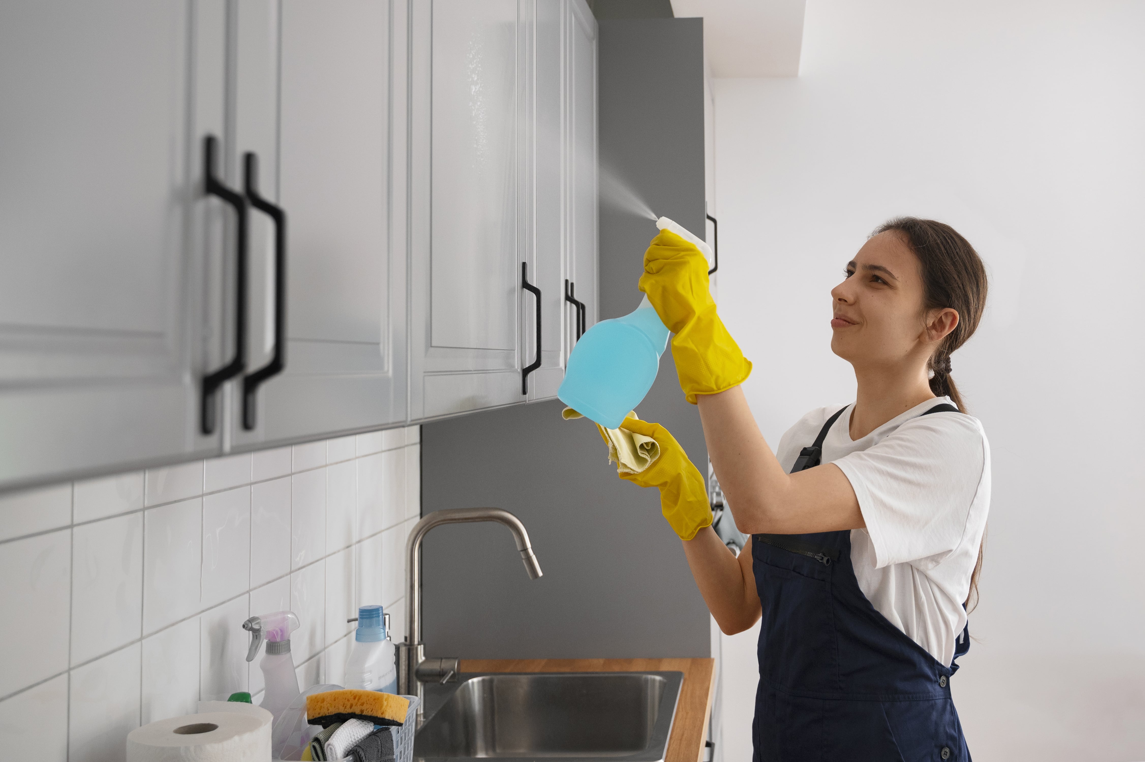 medium shot woman cleaning home