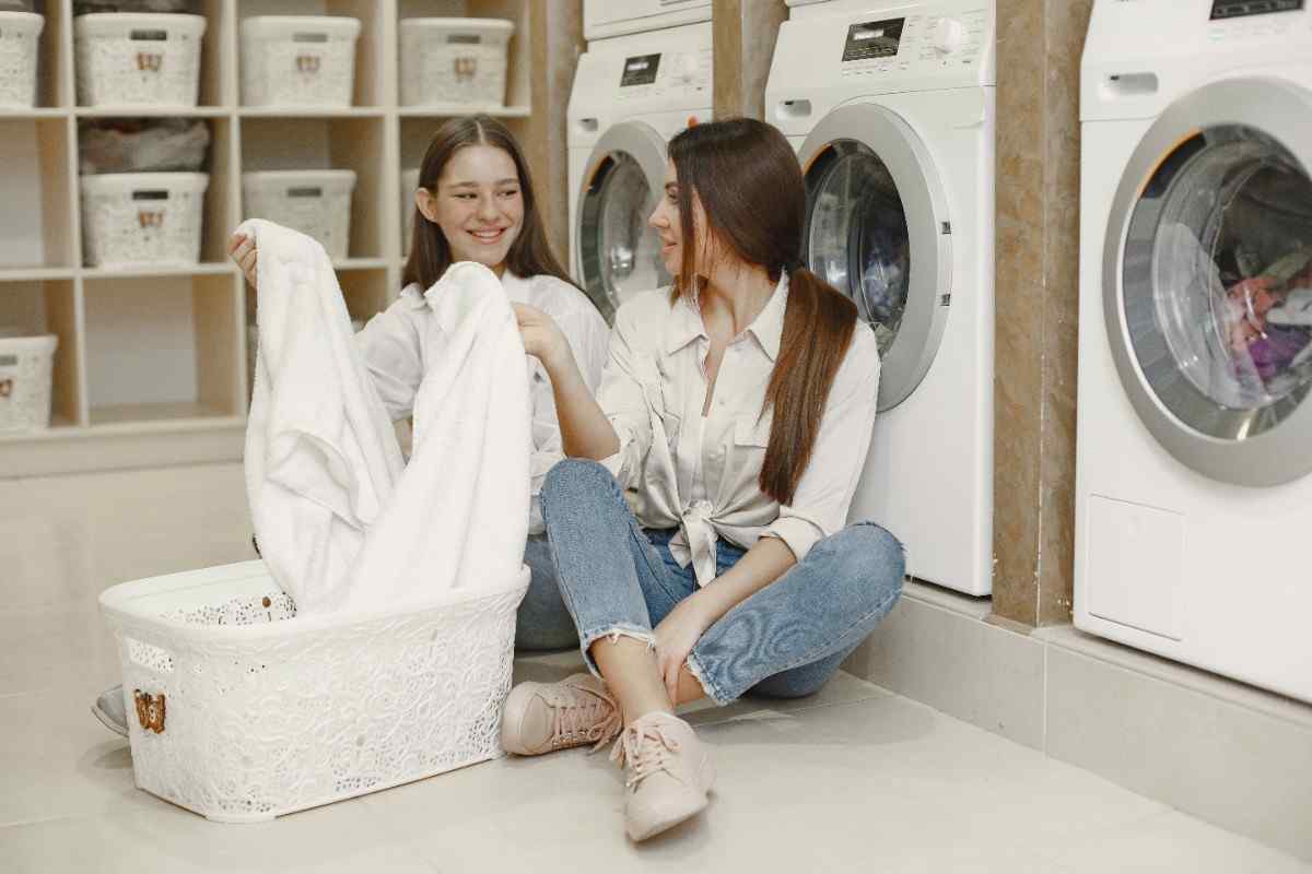 Doing laundry young girl ready to wash clothes