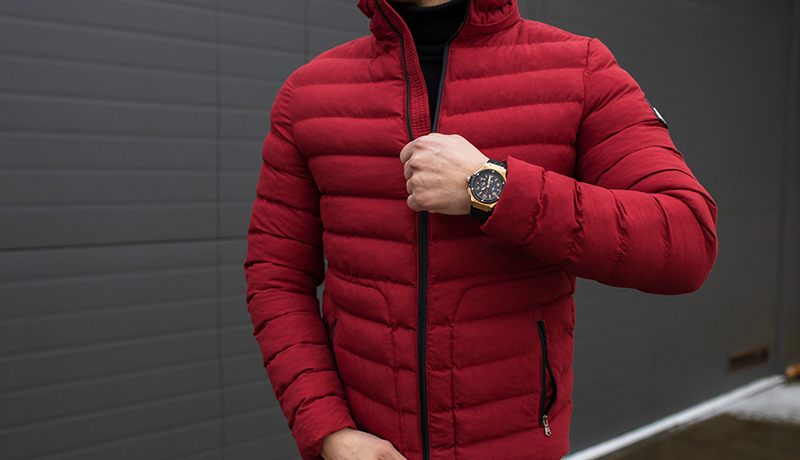 Man in Red Puffer Jacket, Highlighting a Complex Outerwear Item Best Suited for Professional Cleaning